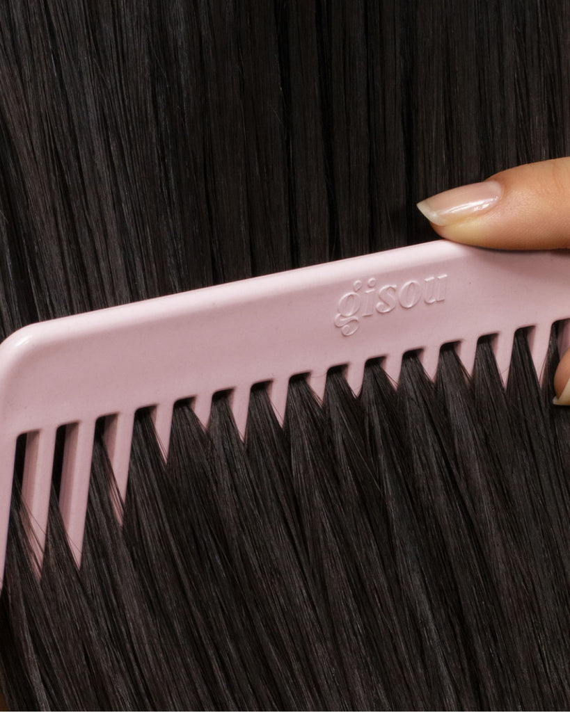 Gisou comb brushing hair